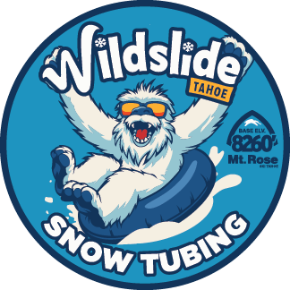 Illustration of a joyful yeti wearing sunglasses, sliding down on a snow tube. The text reads "Wildslide Tahoe Snow Tubing" and "Base Elev. 8260' Mt. Rose" on a blue circular badge. Mt. Rose Ski Tahoe