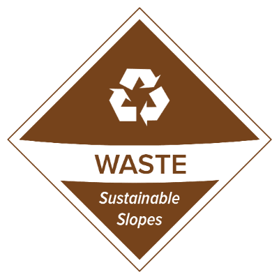 Brown diamond-shaped sign with a white recycling symbol above the word "WASTE" and the phrase "Sustainable Slopes," promoting sustainability on the mountain. Mt. Rose Ski Tahoe