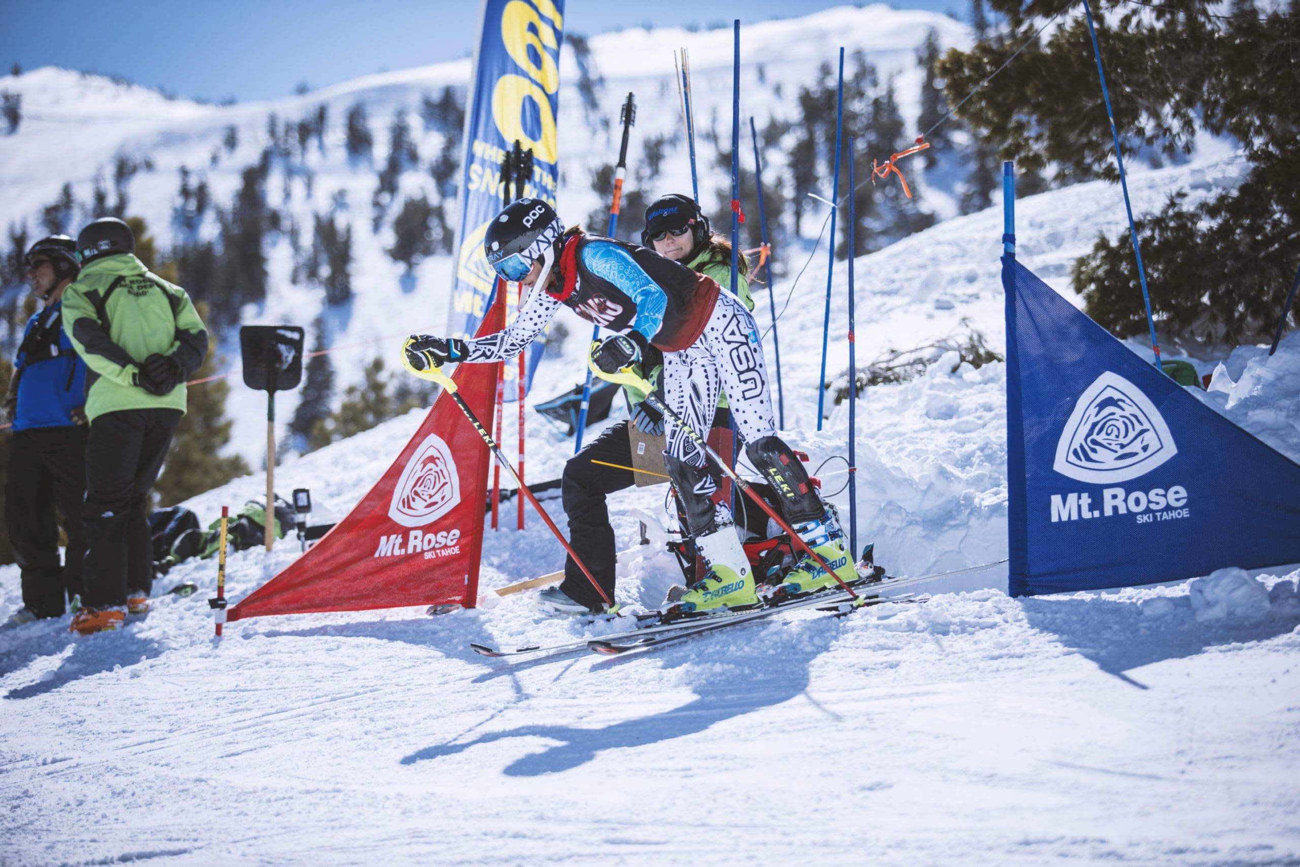 A ski racer in a USA-branded suit pushes out of the starting gate at a Mt. Rose race course. Mt. Rose Ski Tahoe